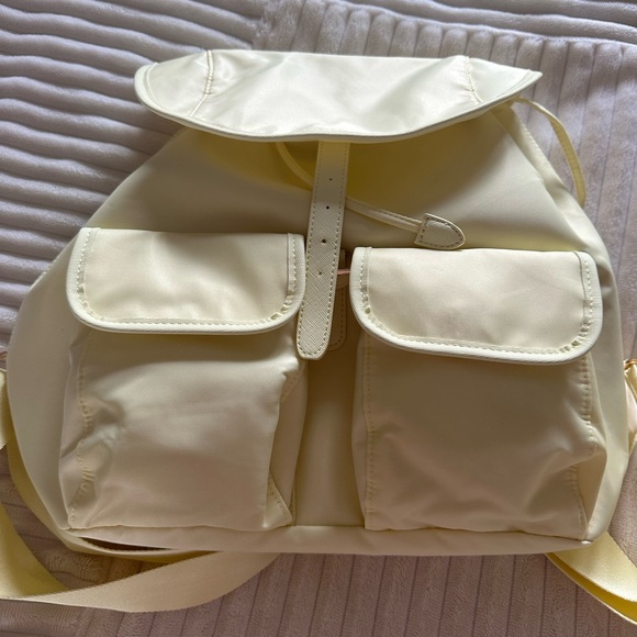 Year of Ours Handbags - Year of Ours Pale yellow Backpack with Dual Front Pockets